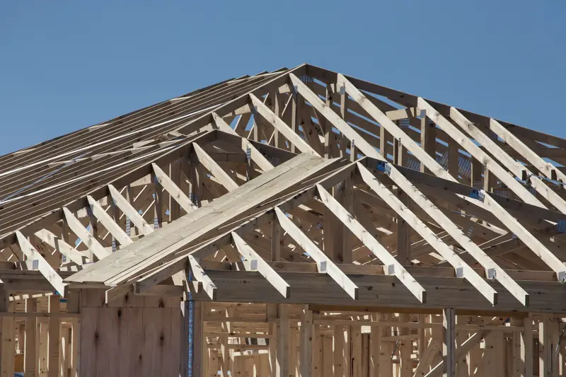Wood-framed house under construction on a residential job site